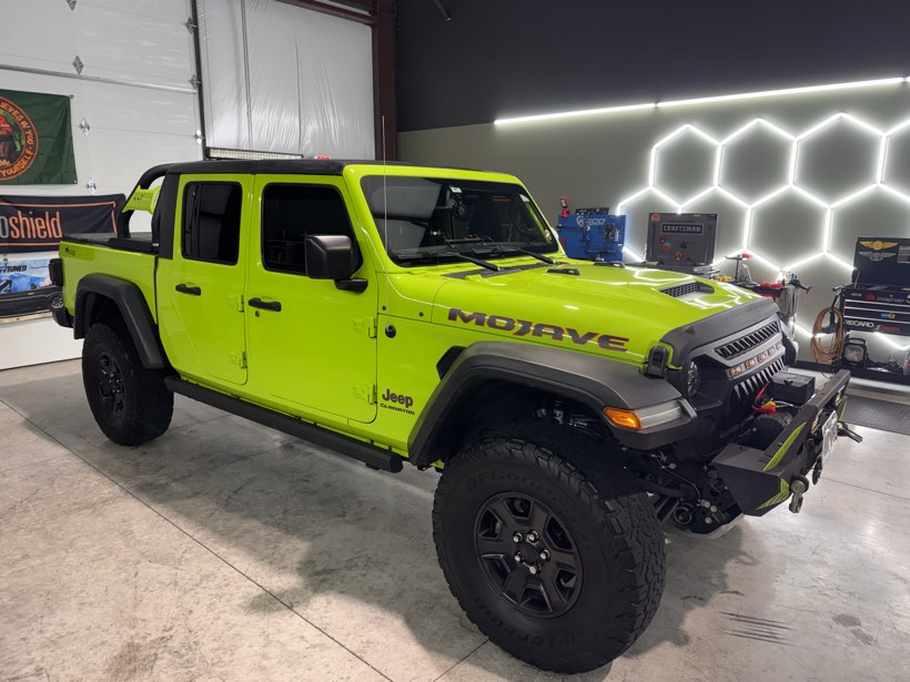 Bright green Jeep Gladiator Mojave after a full detail at The Auto Film Studio