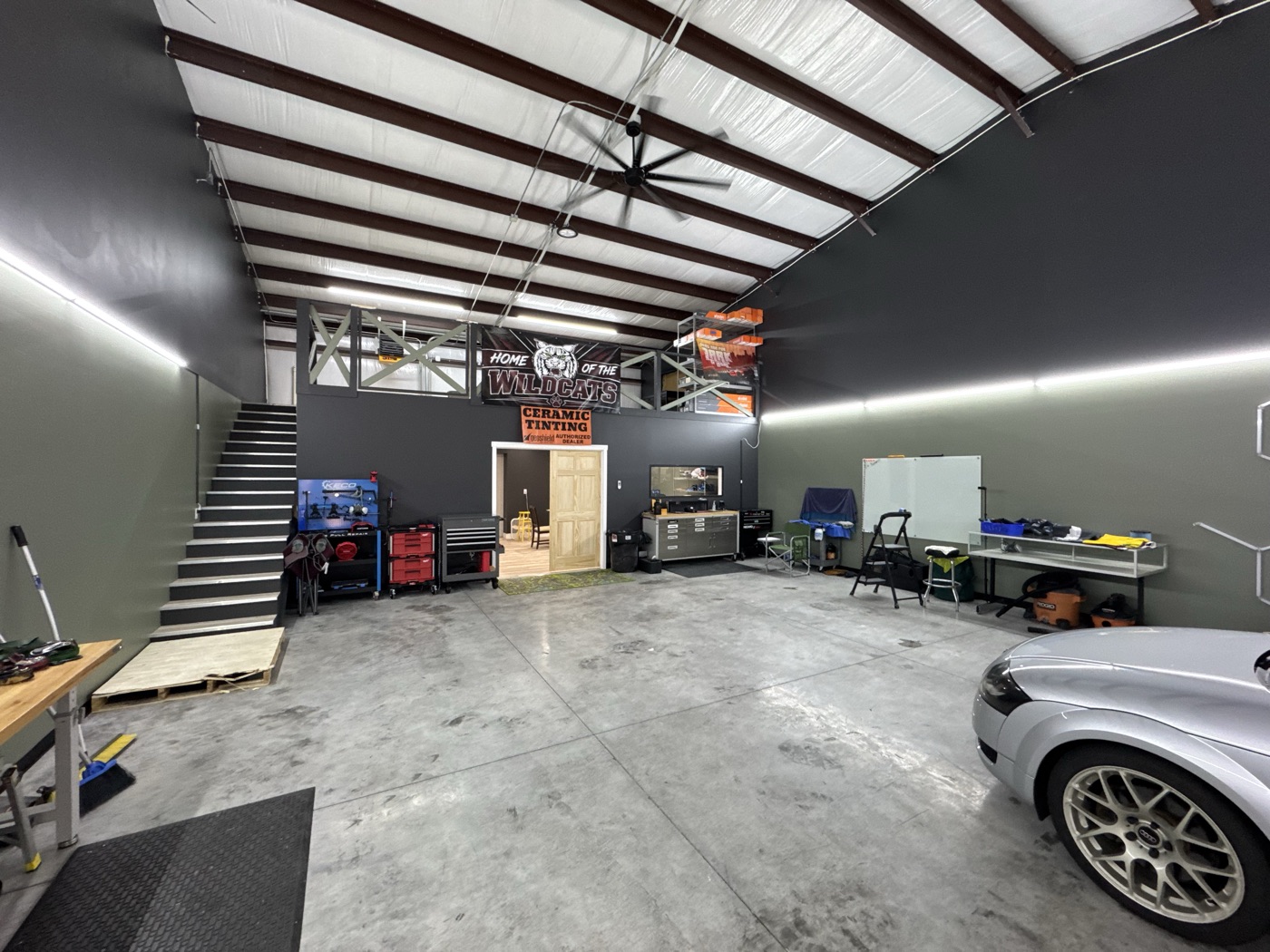 Inside The Auto Film Studio — clean install bay with ceramic tinting signage