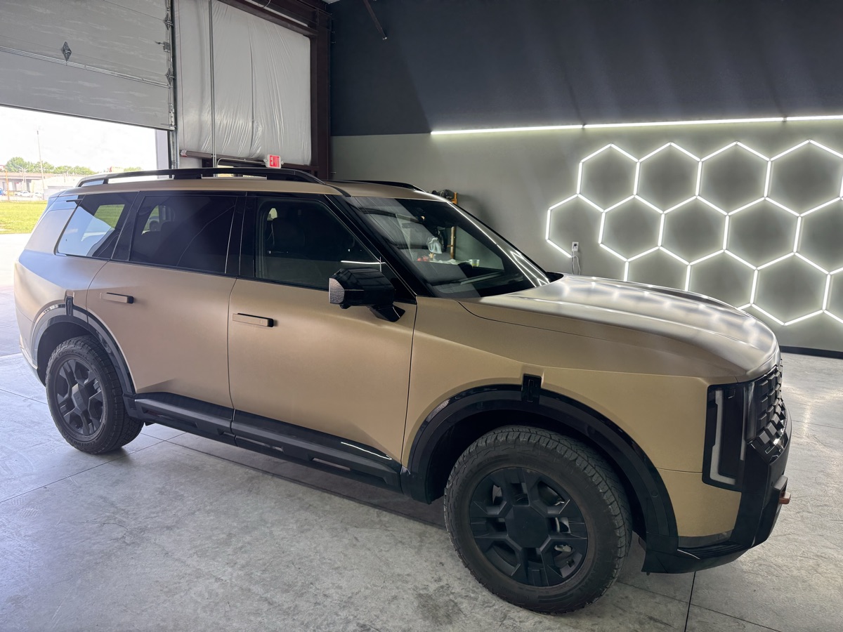 Kia Telluride in a tan matte vinyl color-change wrap